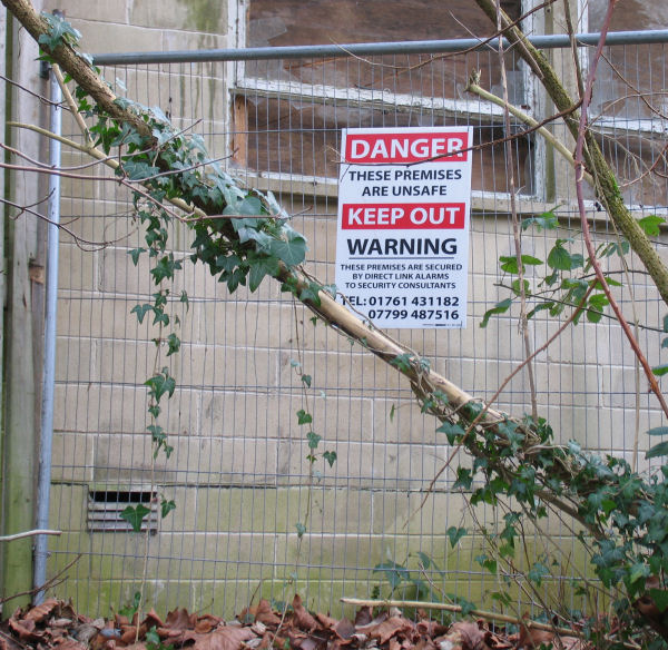 Peradins Warning notice on fence at the Freshford Mill site currently owned by Suttons
