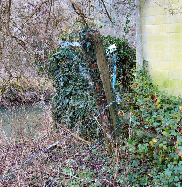 fencing removed by corner of building Freshford Mill