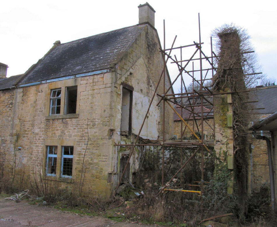 old building Freshford Mill Somerset with measures taken to retain gable wall