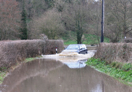 Car risking flood at Freshford Somerset 2008l 